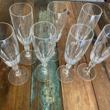 Set of 7 champagne flutes. Made of cut crystal.