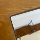 Small contemporary console in stained walnut wood.