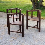 Set of three brutalist tripod armchairs in carved solid oak