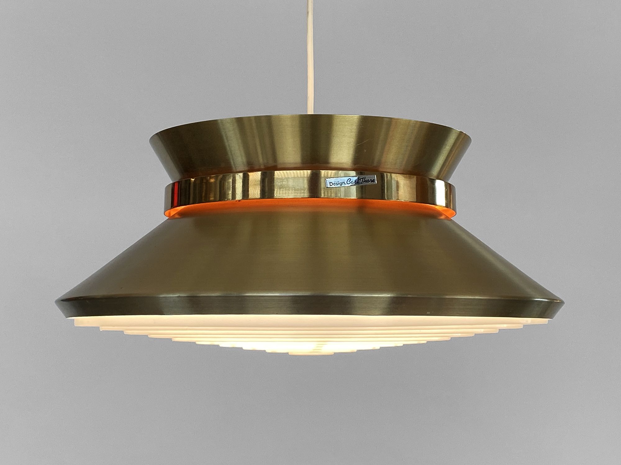 Brass colored aluminium pendant light by Carl Thore for Granhaga Metall. Sweden 1970s.