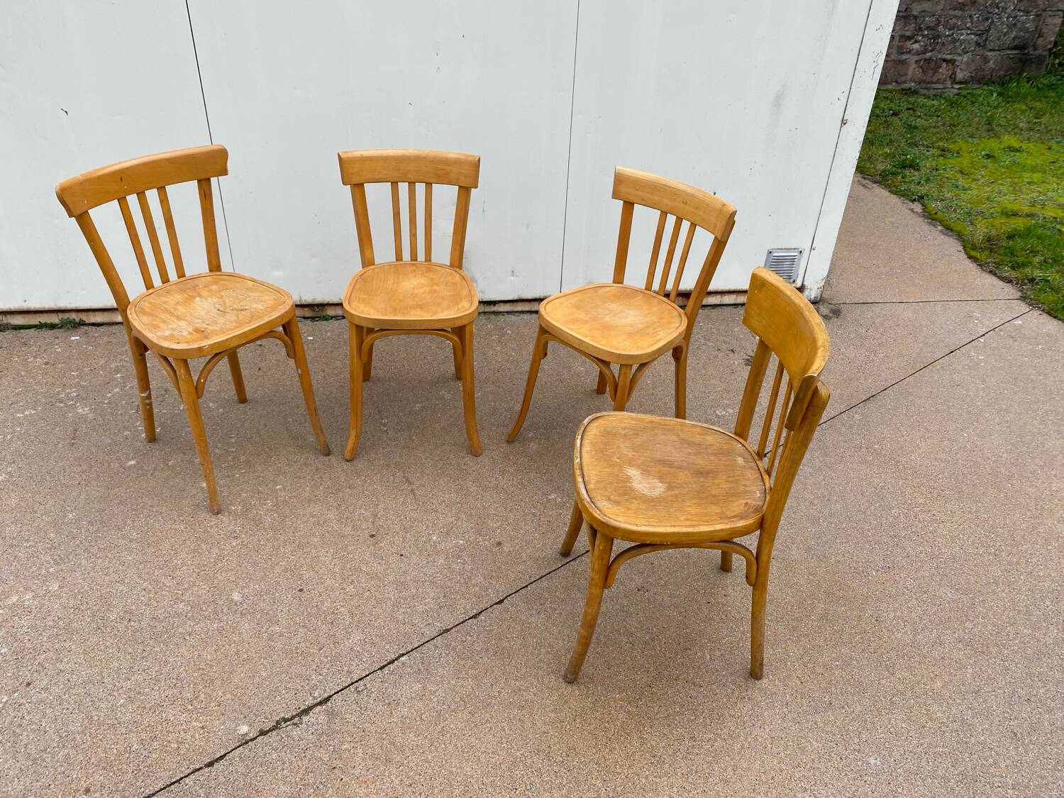 Curved varnished bistro chairs