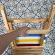 Folding chair in wood and striped fabric