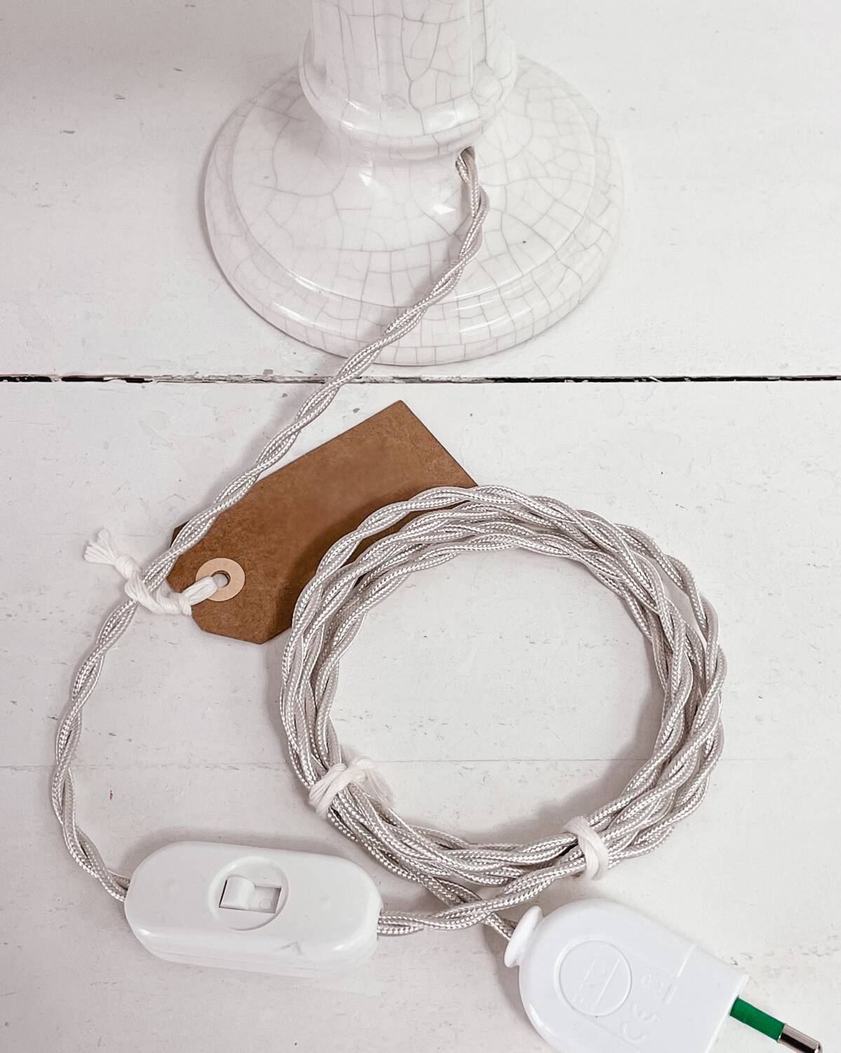 Earthenware lamp and striped lampshade