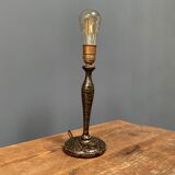 Black table lamp with paint splatters from the 1920s