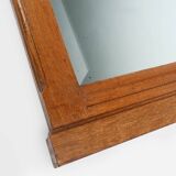 Miroir Art Déco en chêne à décors sculptés et miroir à facettes, années 1930