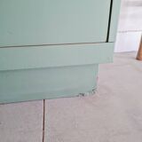 Old chest of drawers with two green drawers