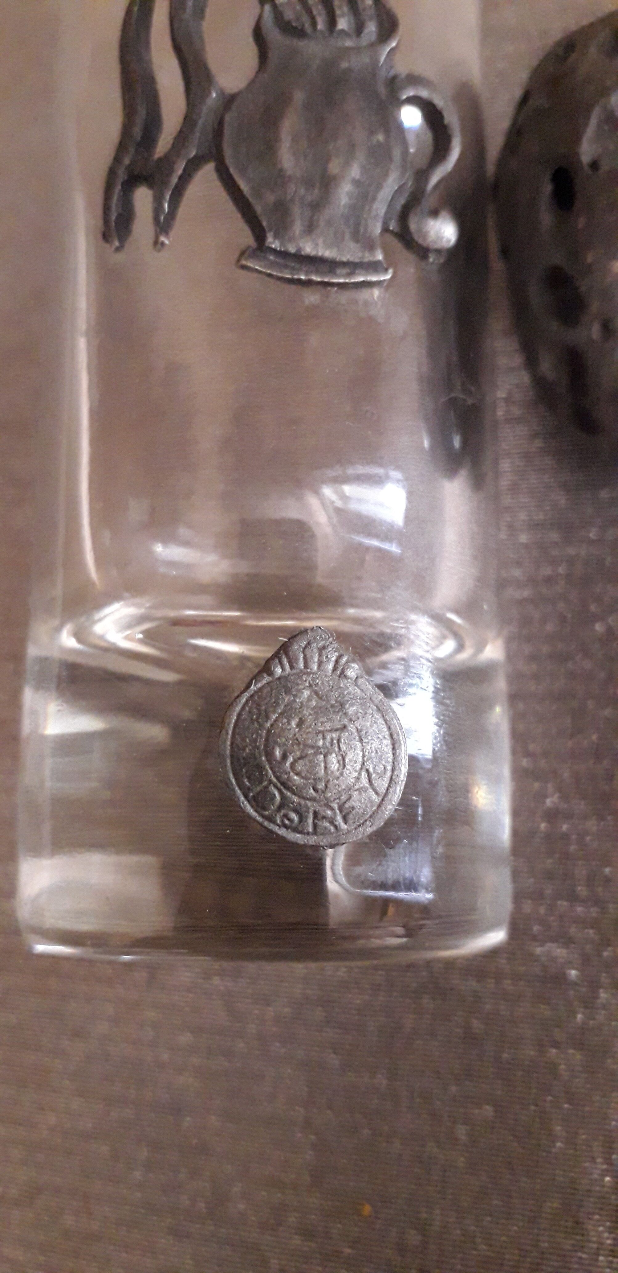 Glass liquor glass with tin sconces signed J.de Rey