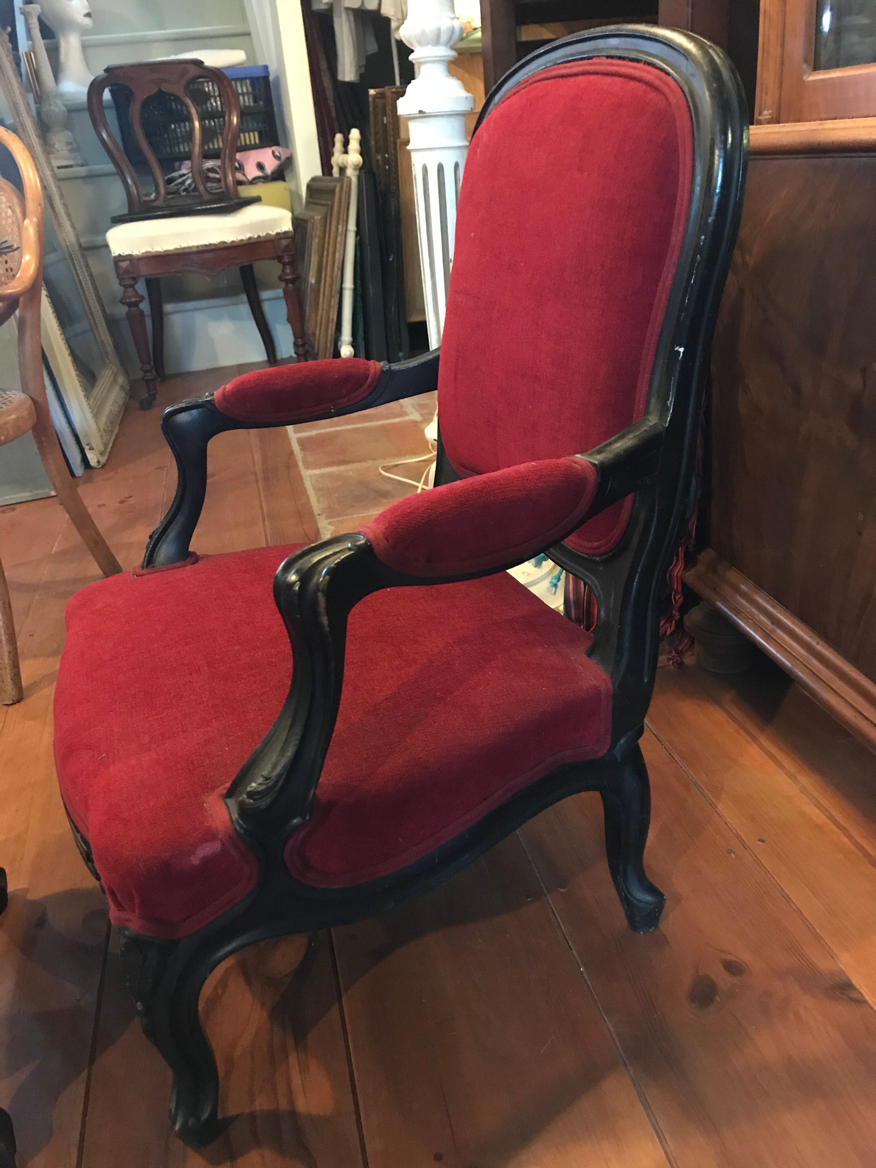 Old children's armchair with foot rests