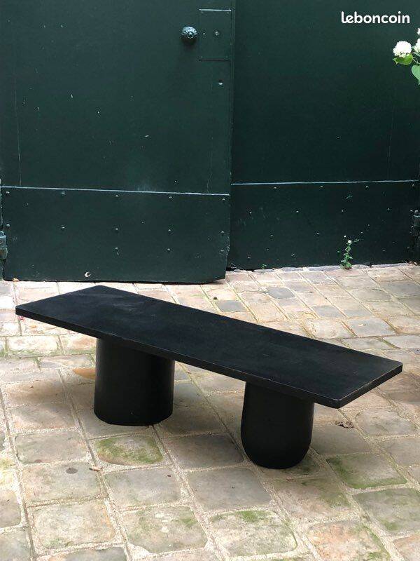 Rectangular coffee table in stained black wood with ball and cylindrical legs.