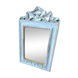Mirror with ornament