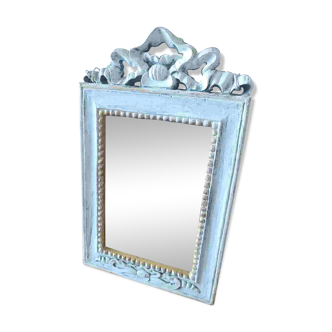 Mirror with ornament