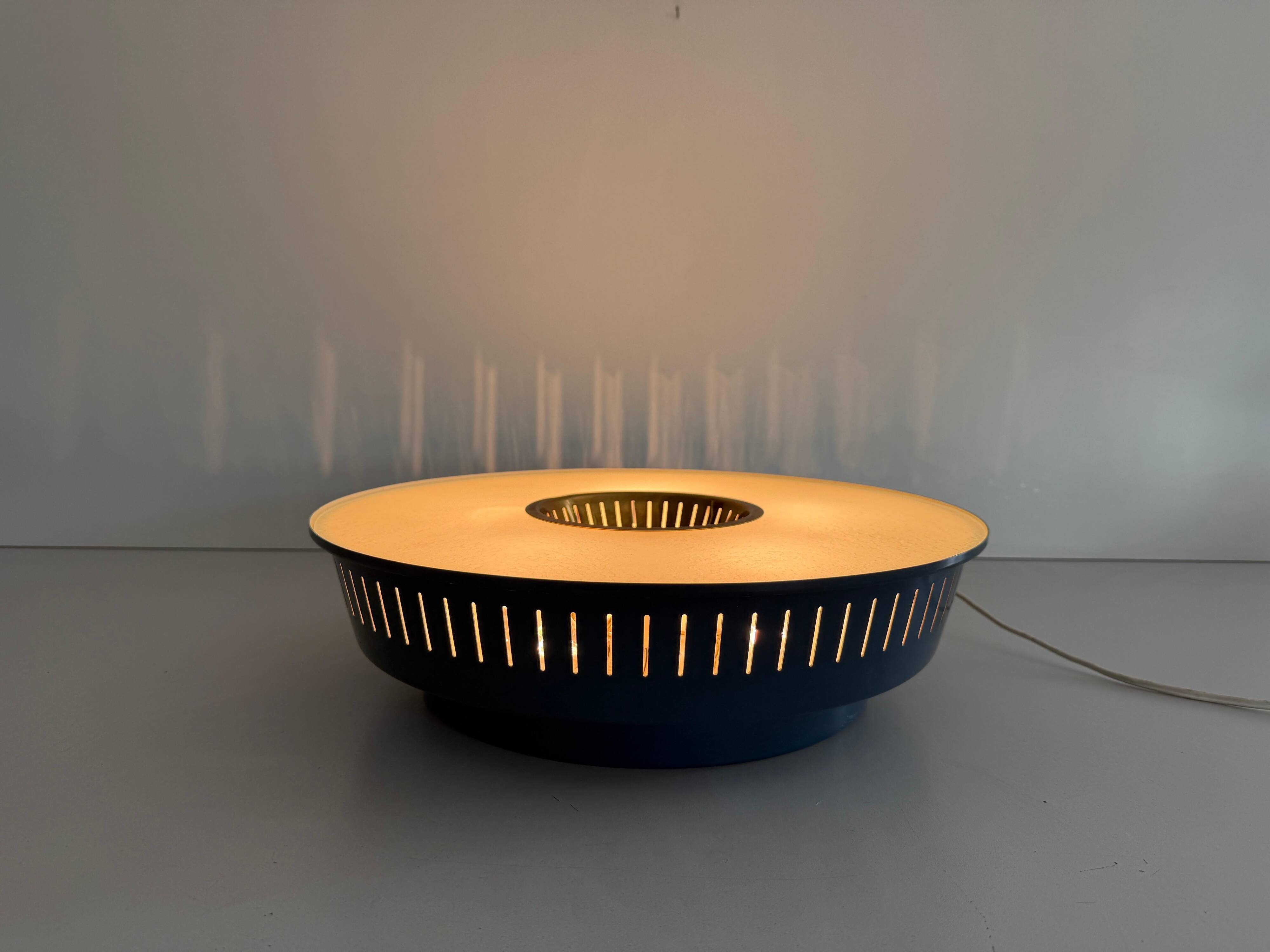 Flush-mounted metal frame with dark blue glass, Attributed to Stilnovo, 1950s, Italy.