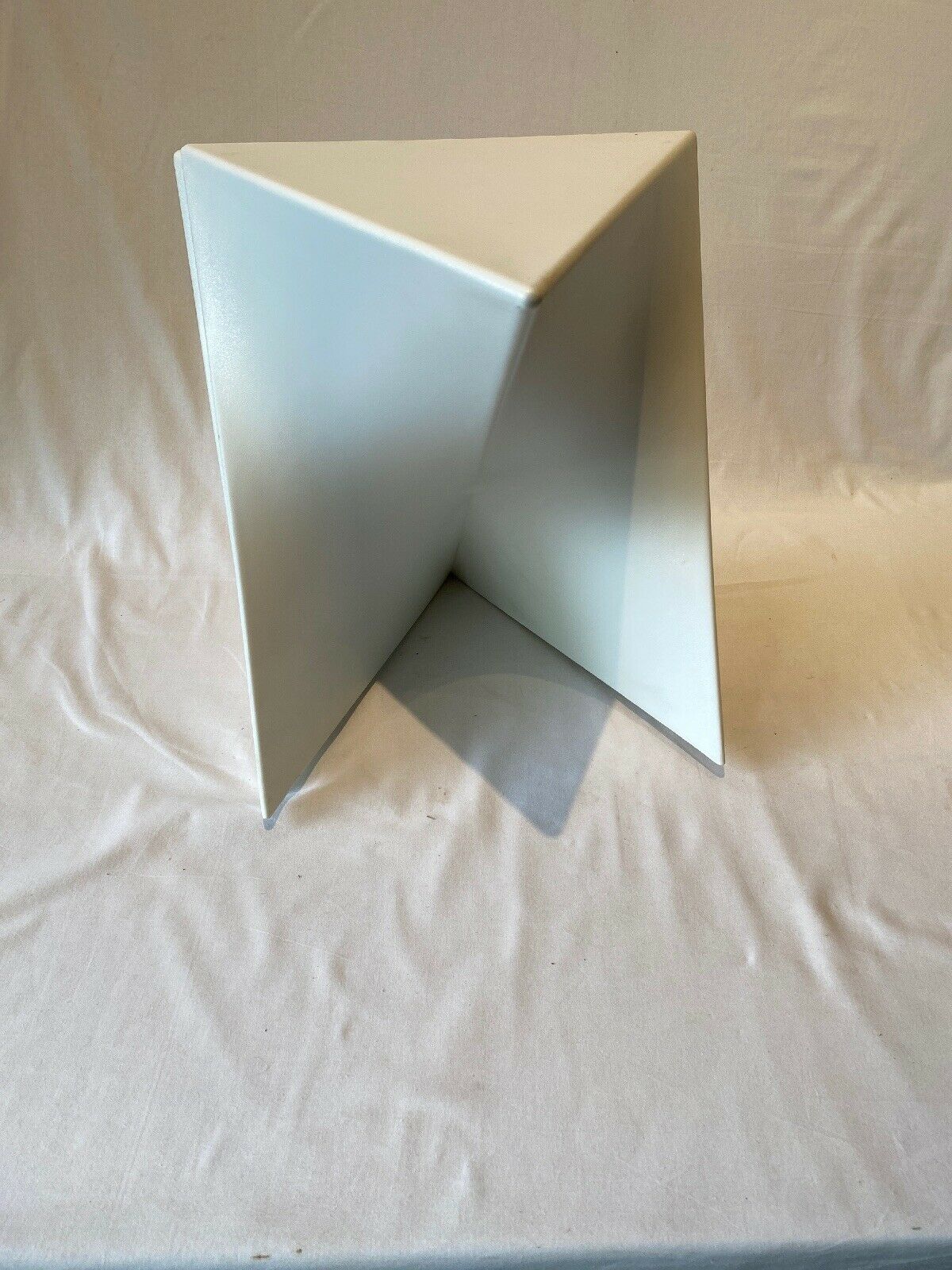 Pair of unmarked triangular white design stools