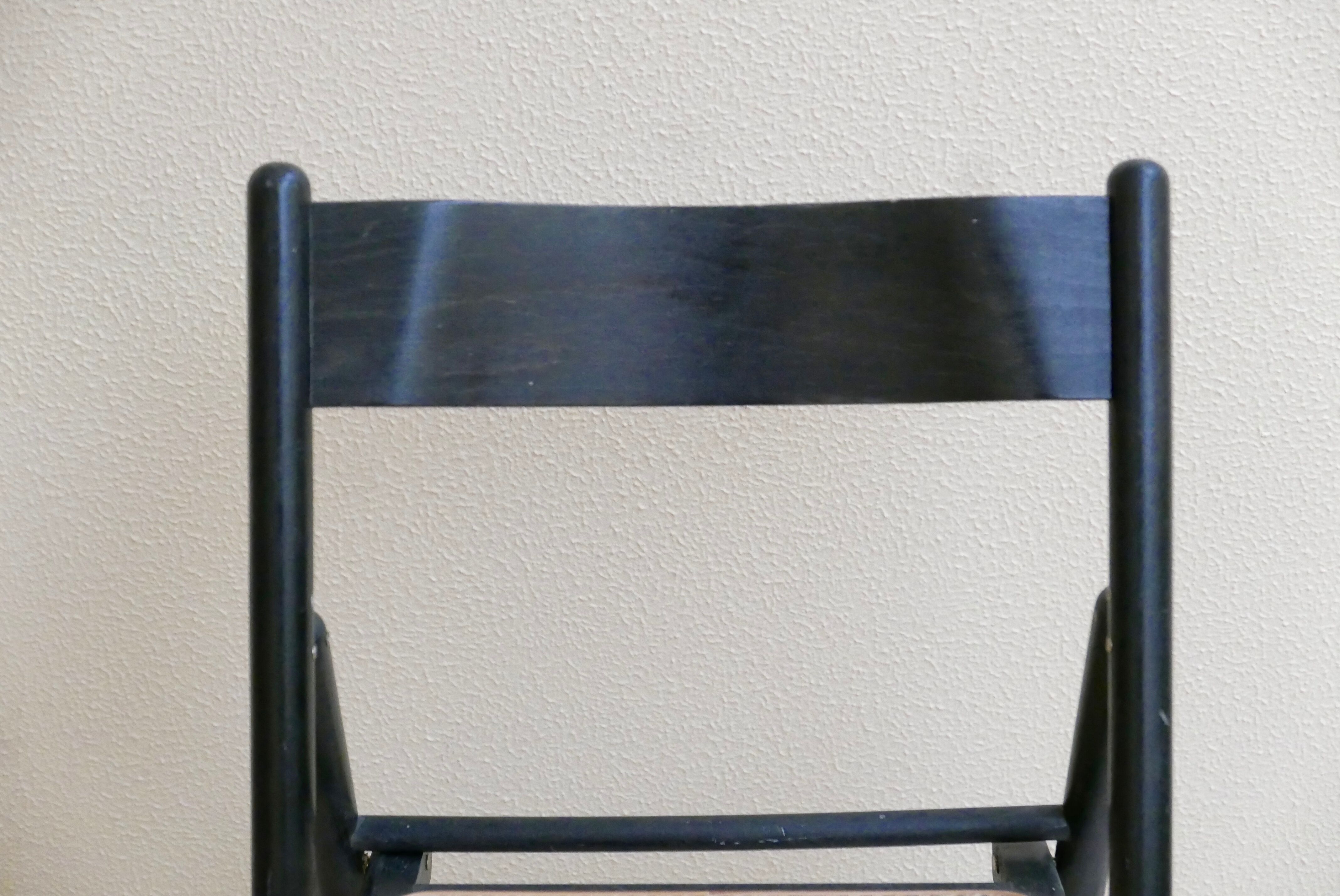 Black folding chair, 70s