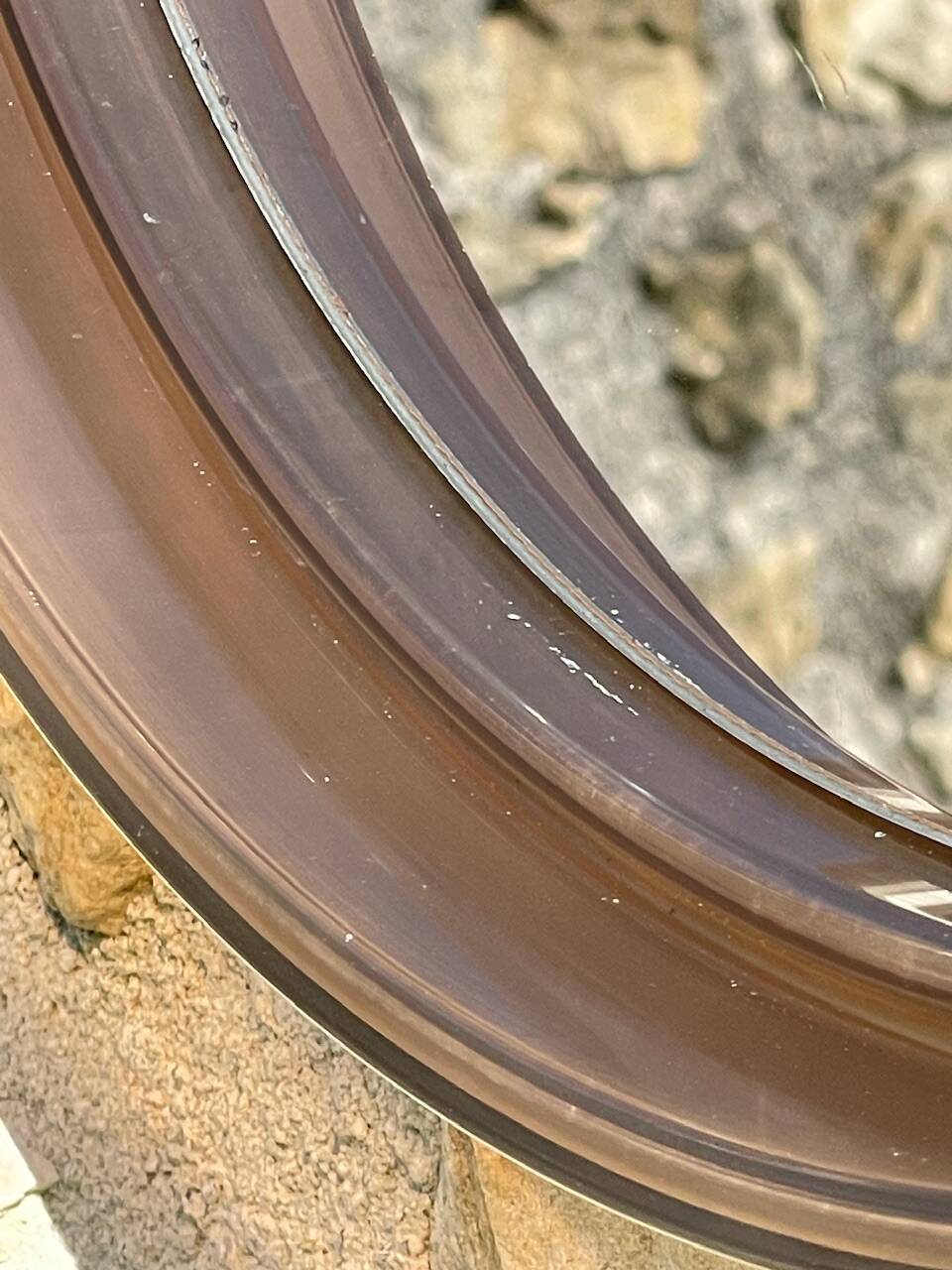 Vintage round smoked plastic mirror, circa 1970s.