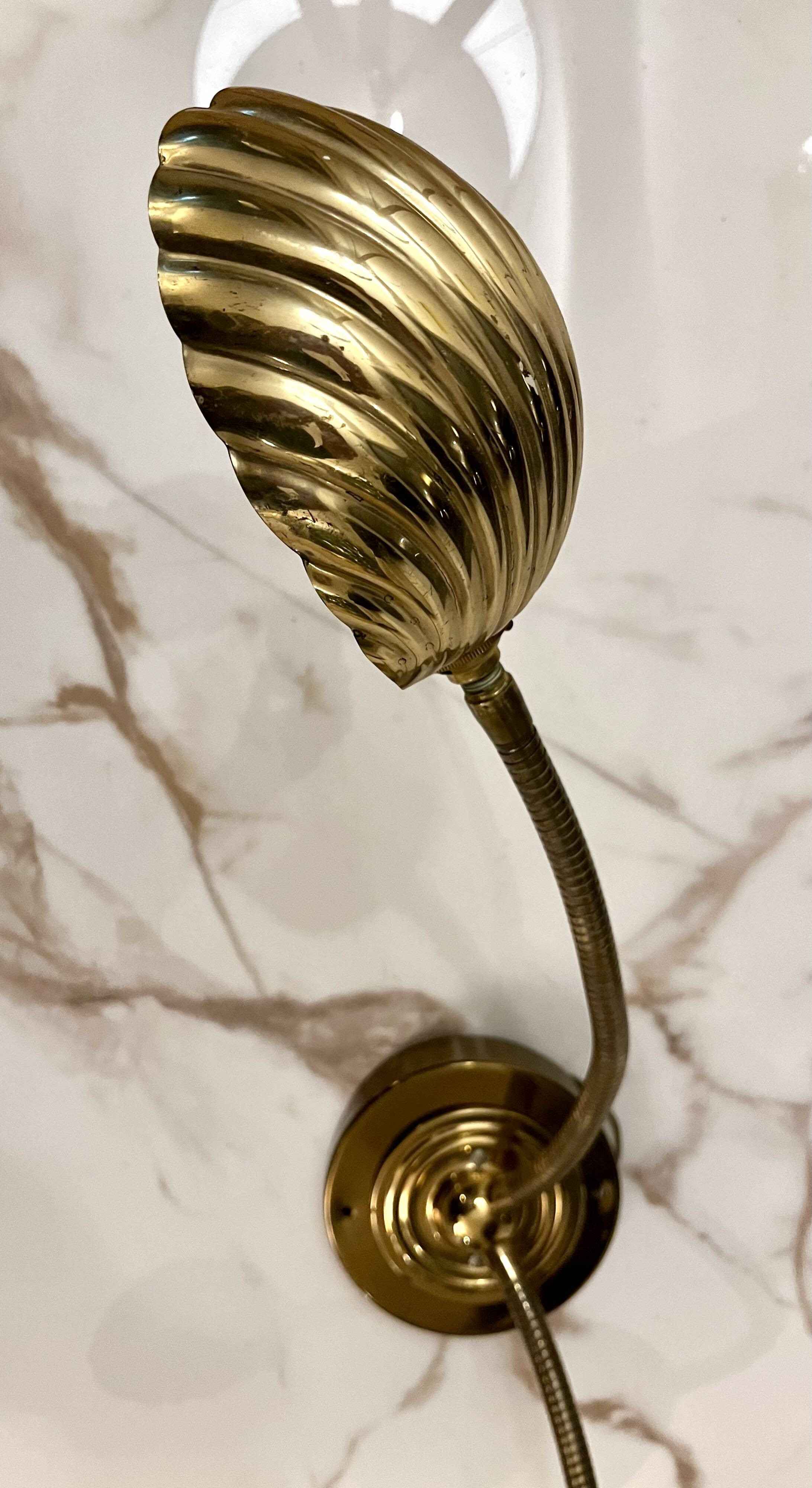 Articulated shell wall light
