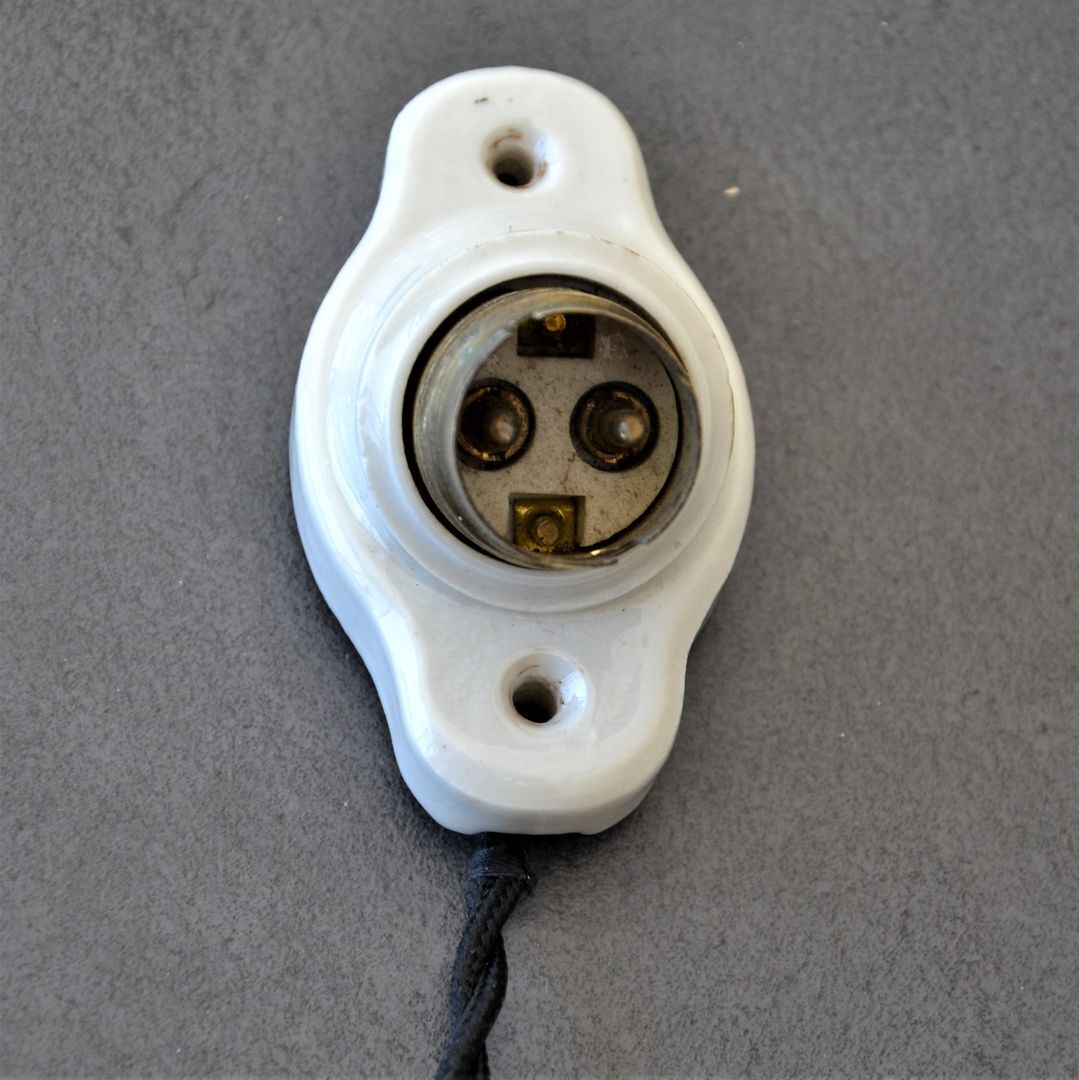 Oval porcelain hook to plug into socket