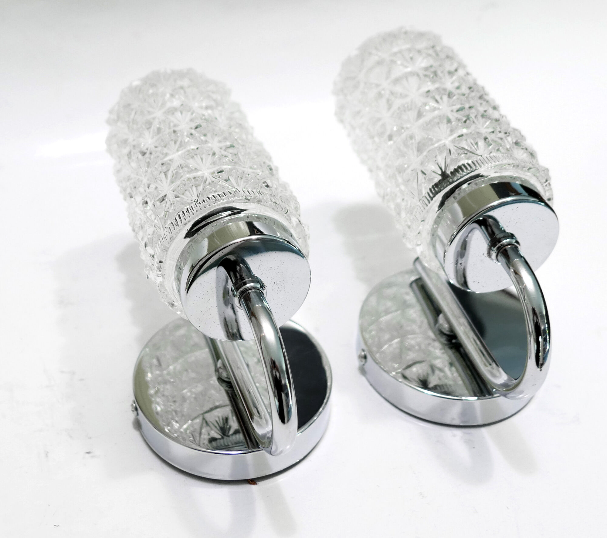 Pair of 1970 chrome metal wall light and molded glass globes.