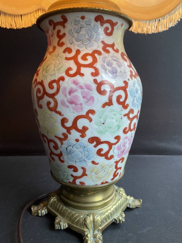 Old Asian vase mounted as a lamp with pagoda lampshade