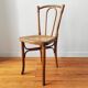 4 mismatched antique bistro chairs in wood and caning