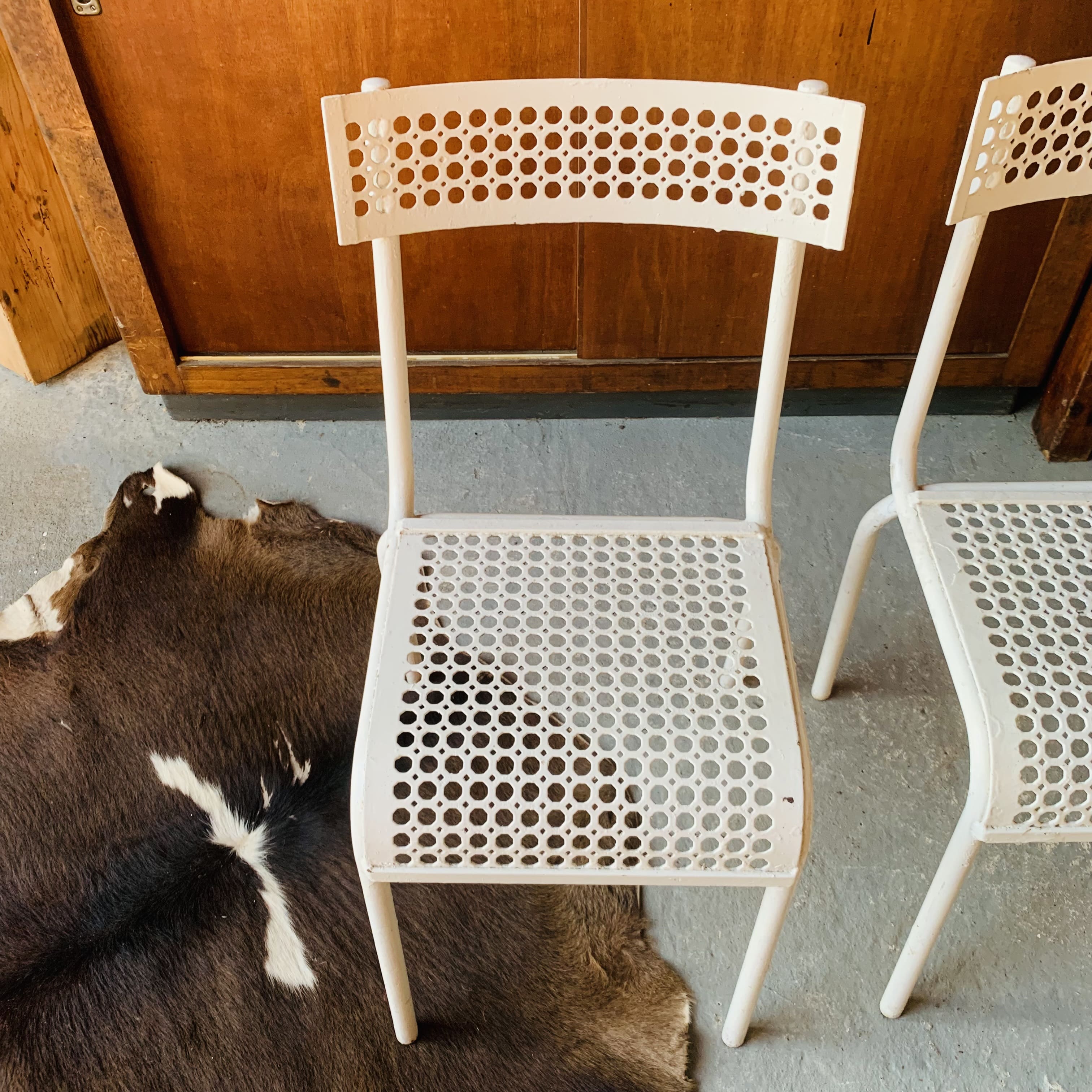 Series of 3 perforated metal chairs