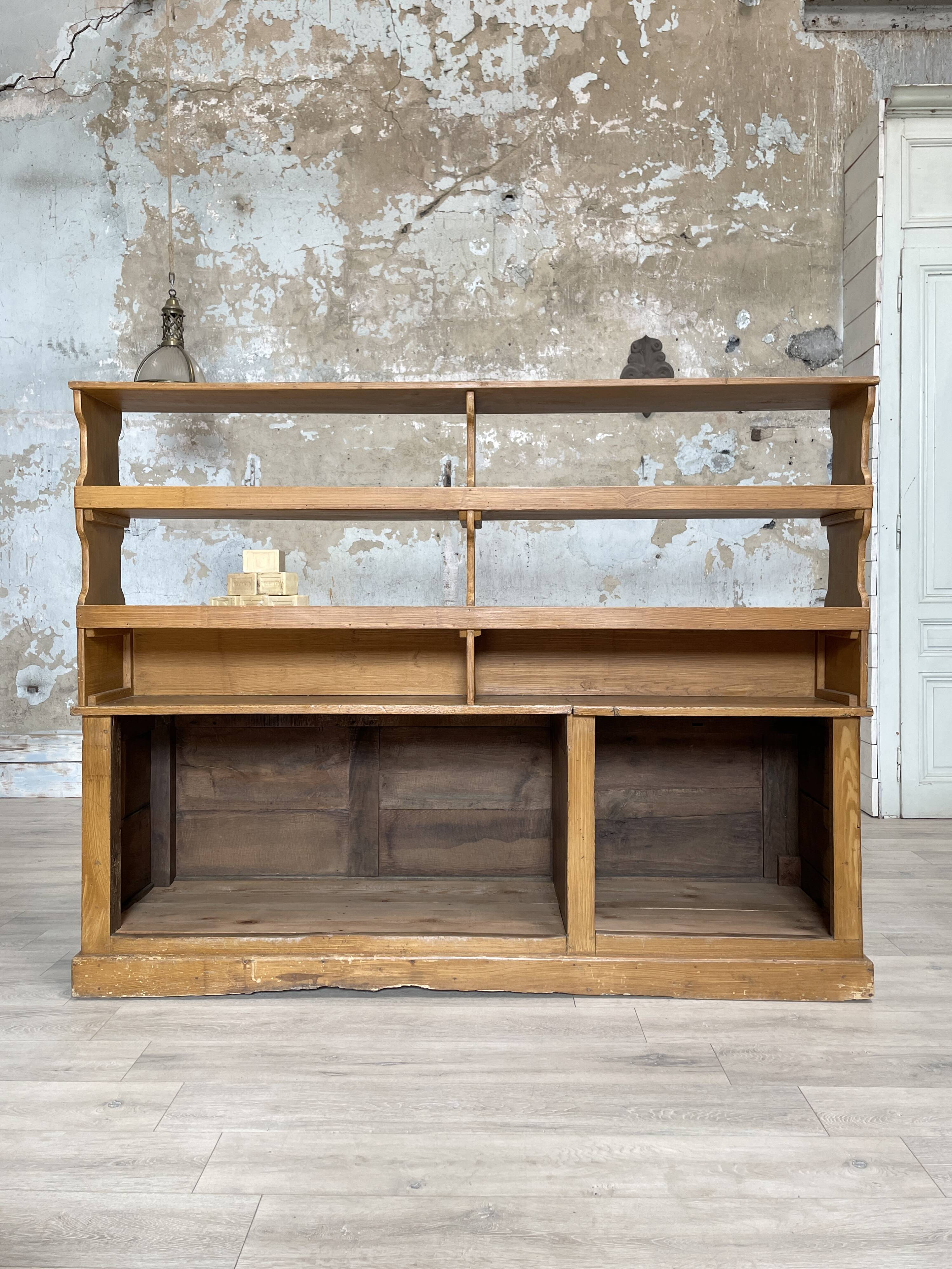Wooden hardware cabinet painted with wood effect, circa 1940.