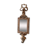 Louis XVI/Baroque style rectangular mirror. In polyresin with golden patina/Cérusée. Fronton knot. Dim. 47 x 14 cm