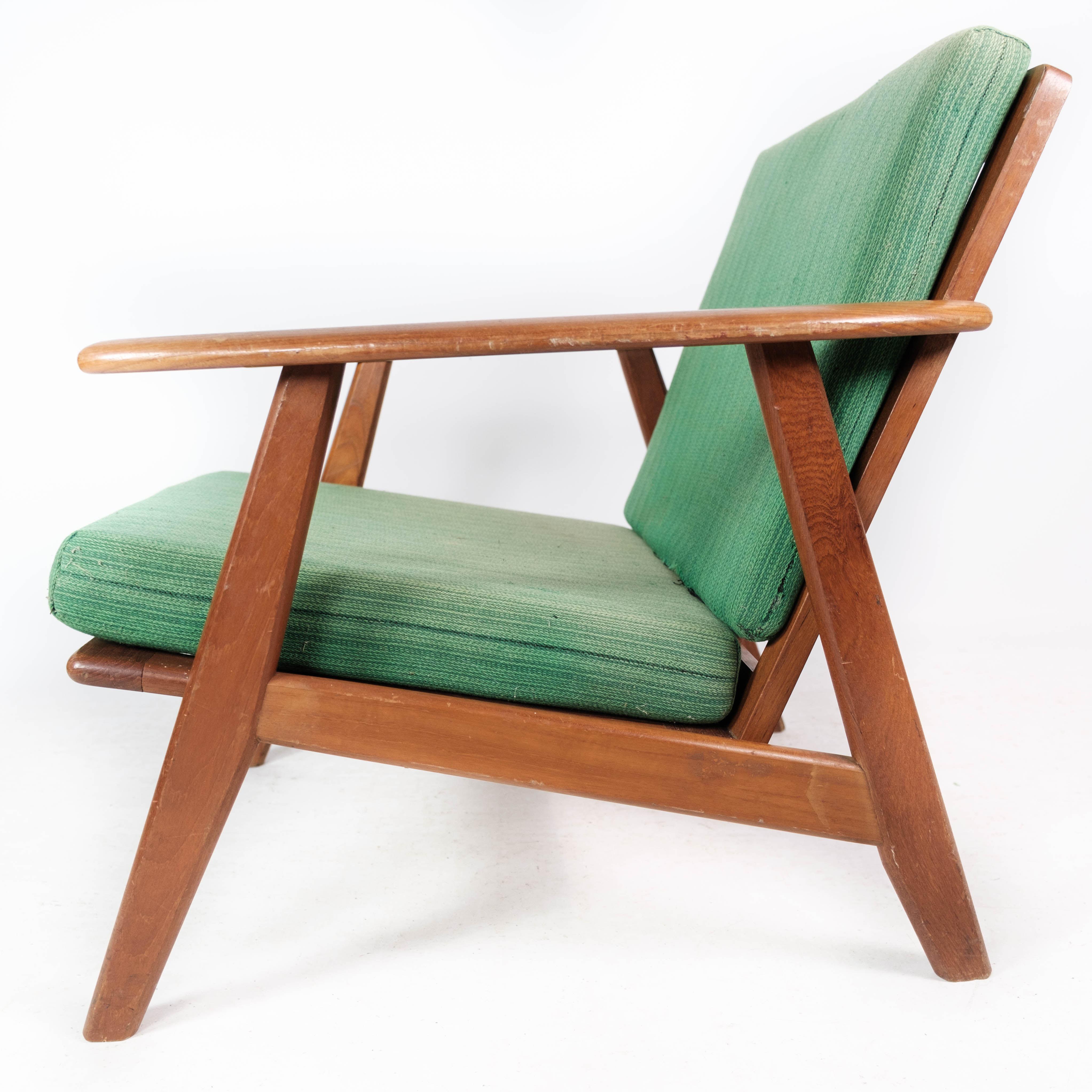 Easy chair in teak and with green upholstery of Danish design, 1960s