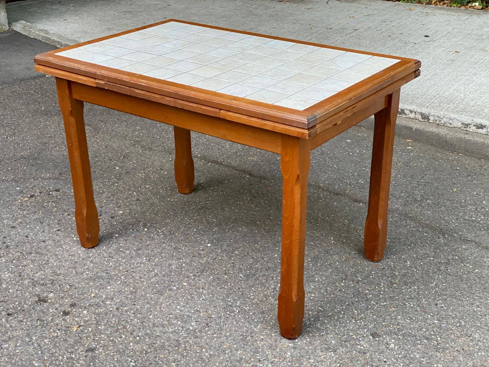 Dining table or farmhouse kitchen style with solid wood and tiles.