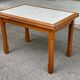 Dining table or farmhouse kitchen style with solid wood and tiles.