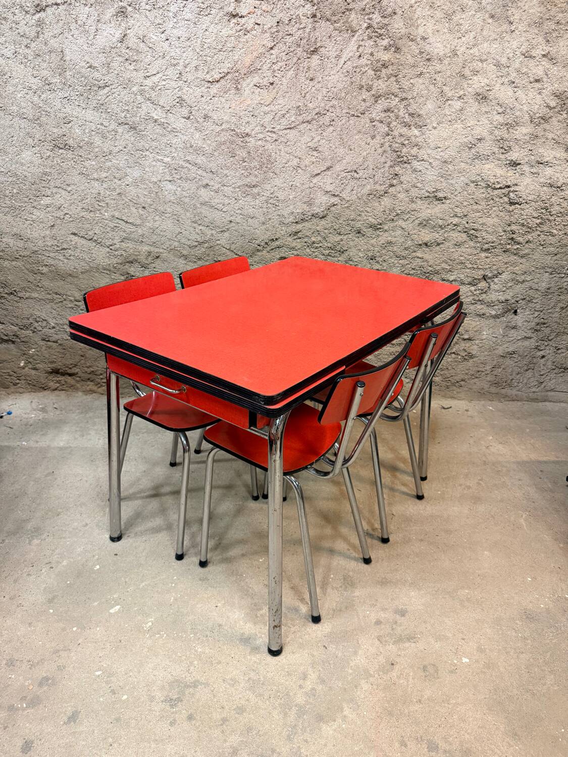 4 red Formica chairs with a 1970s table