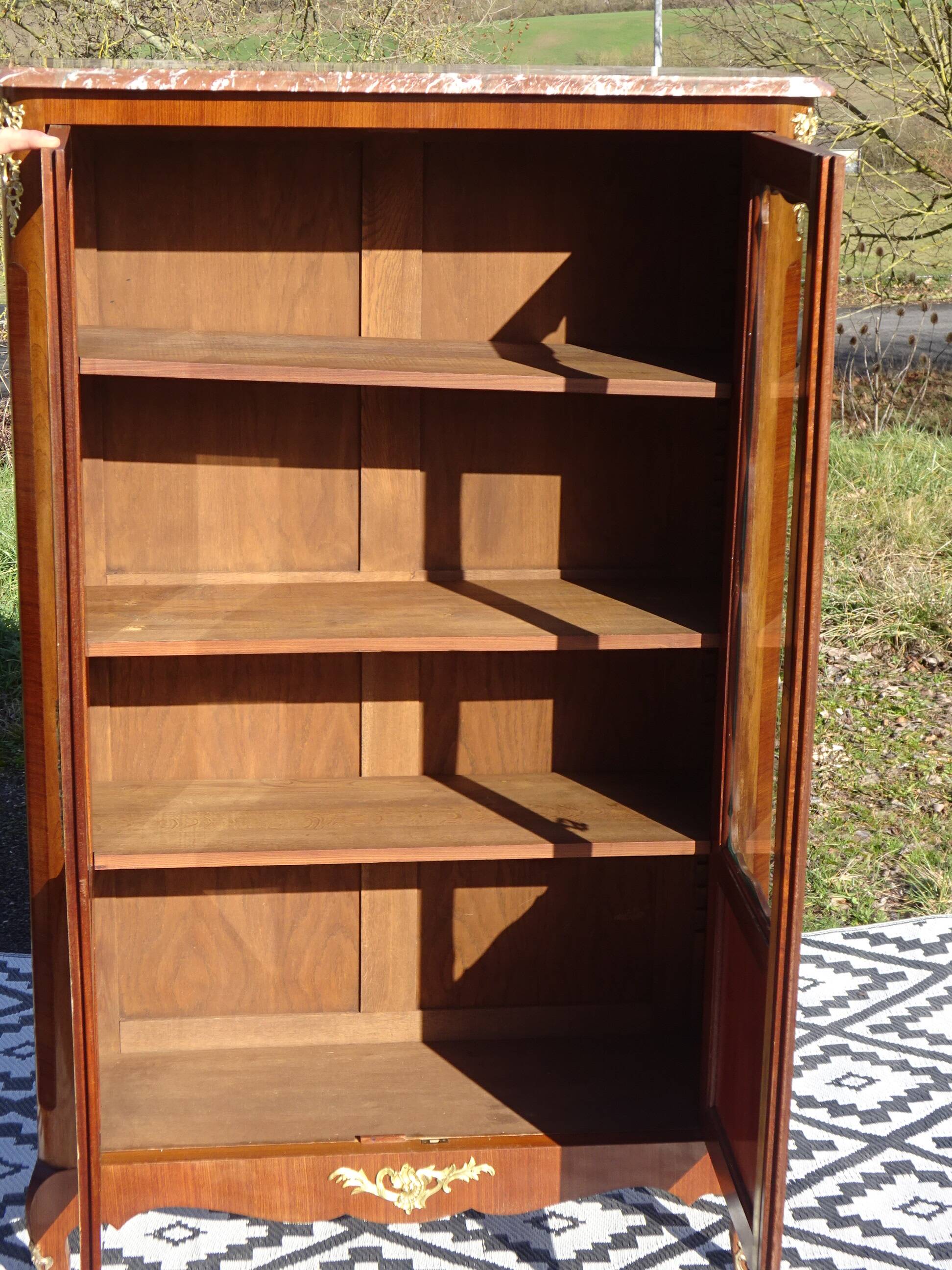Glass library with rosewood marquetry in the Louis XV style.