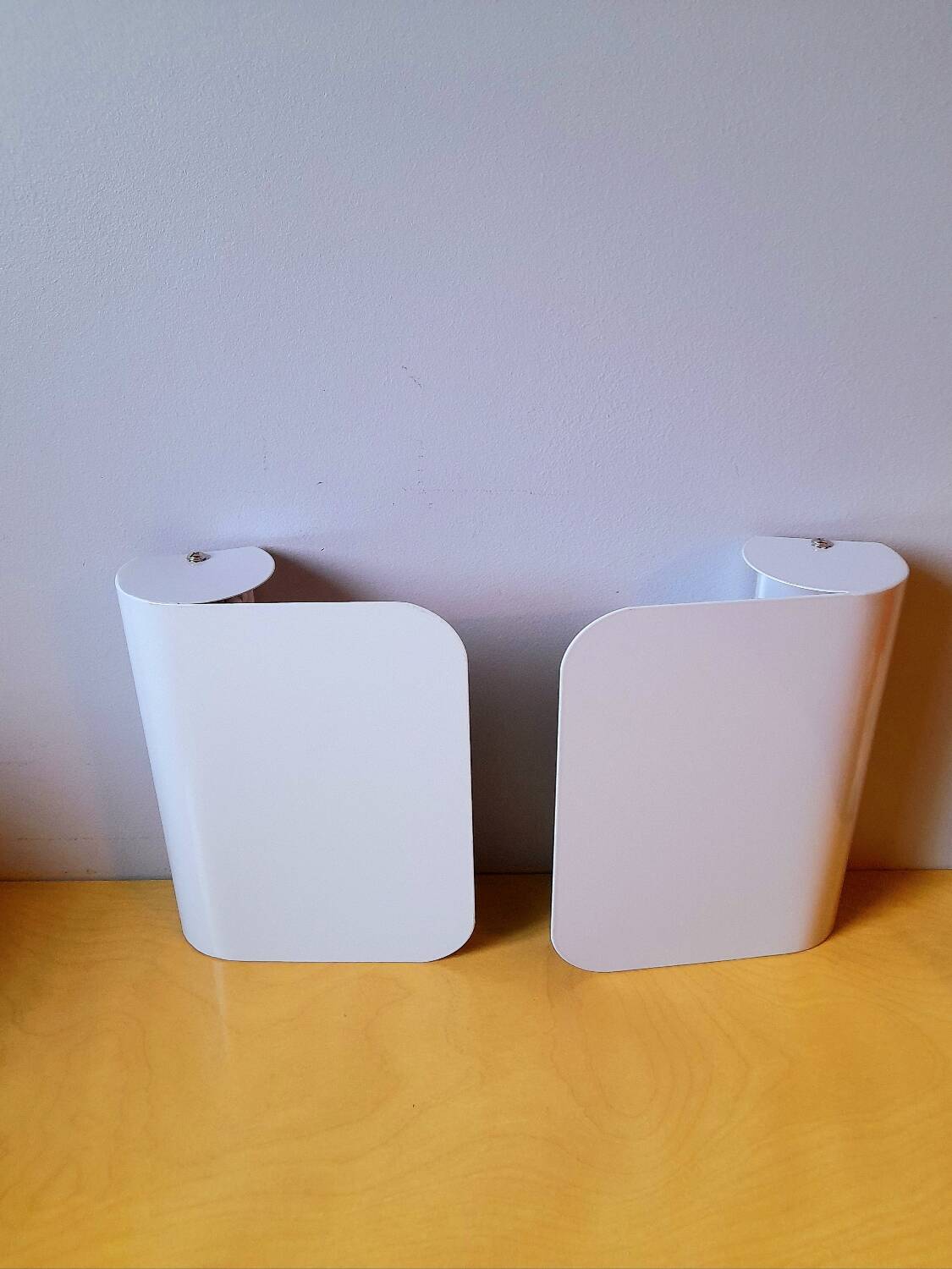 White lacquered metal wall sconces