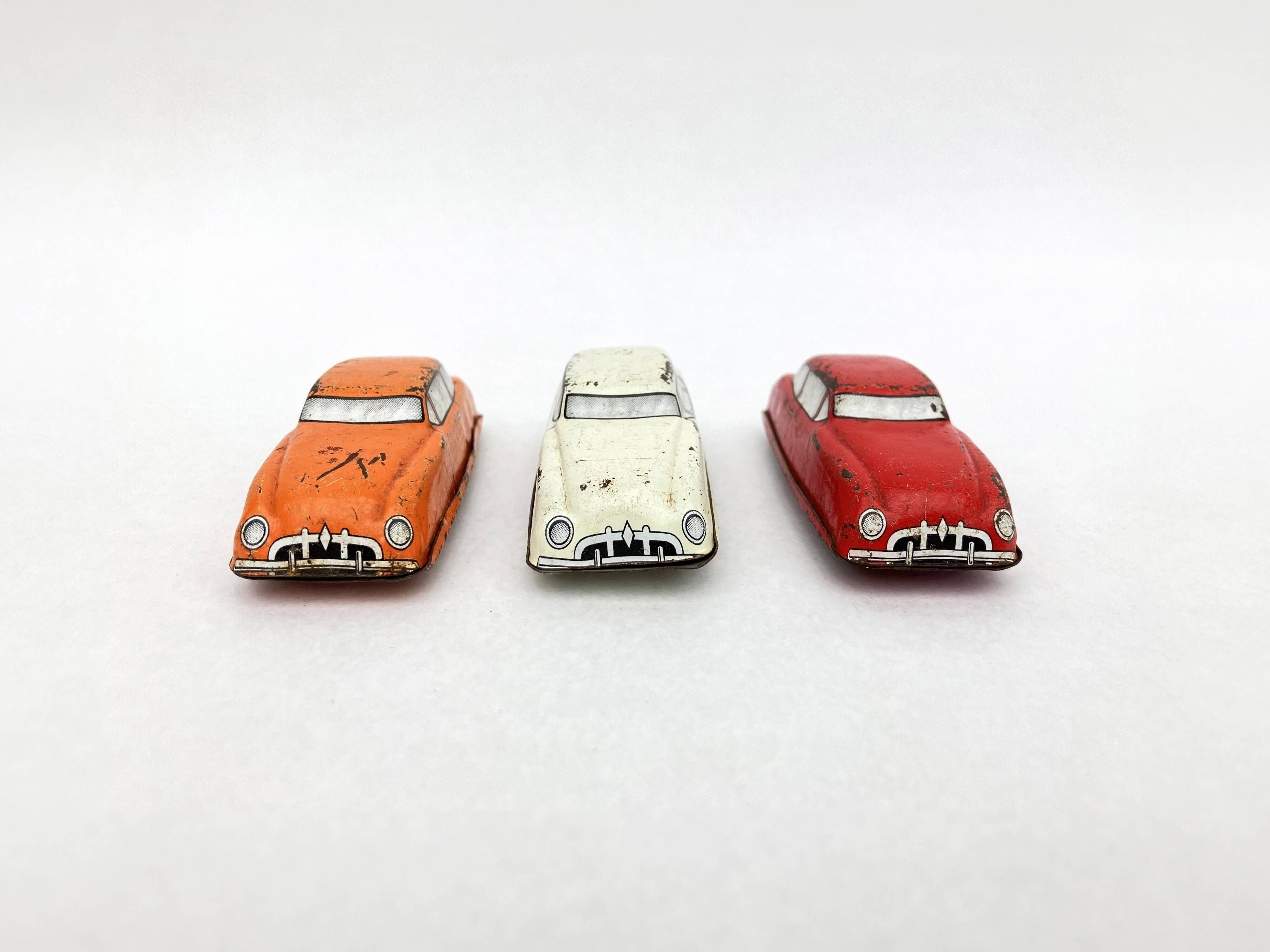 3 old small tin circuit cars with lead wheels • Vintage • 1960s