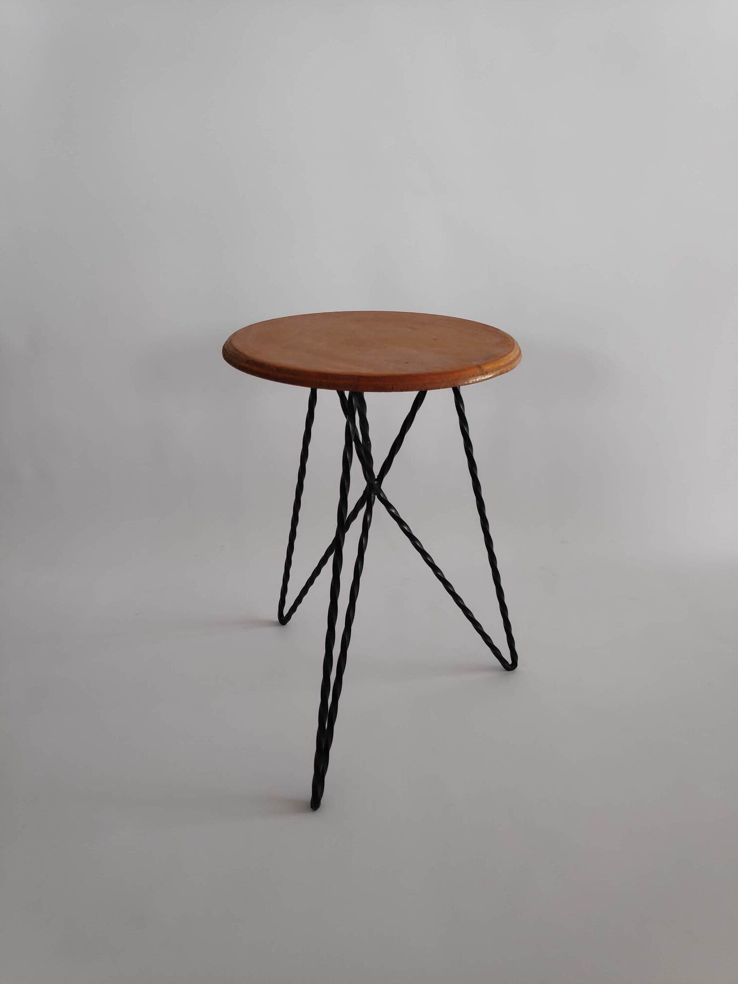 Vintage stool in wood and twisted metal of the years 60