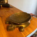 Empty brass turtle pocket