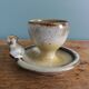 Bird-shaped egg cup in stoneware signed Jean Marie Delahaye Malicornes.