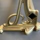 Art-deco wall-mounted coat rack in brass
