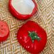 Vintage earthenware set – tomato salt and pepper shakers.