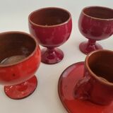 Red enamelled terracotta: cups, saucers, glasses