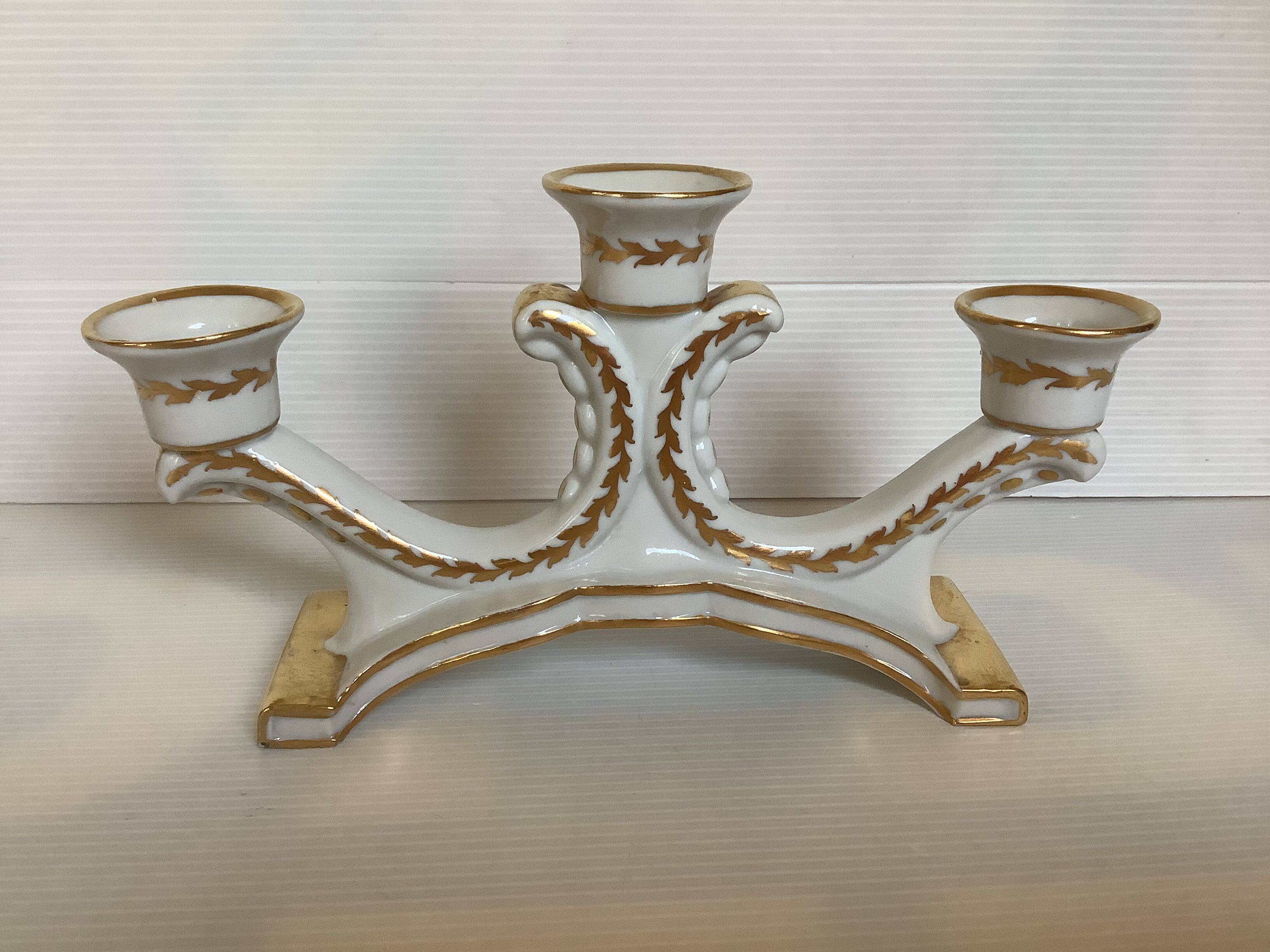 Old white and gold candlestick Belgium