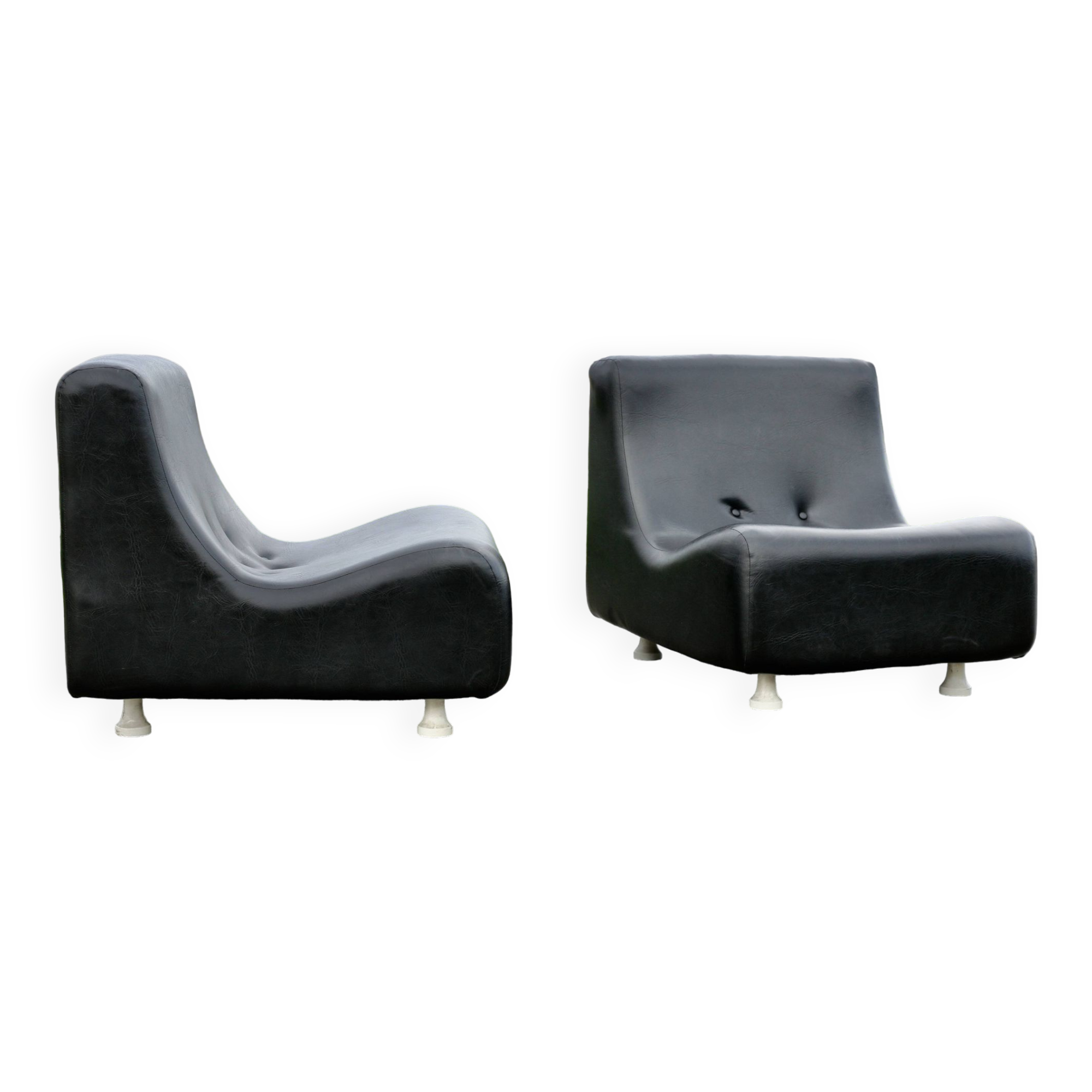 Pair of “space age” low chairs. Black faux leather. Circa 1970