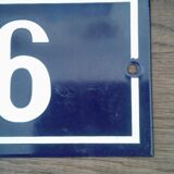 Enamelled street sign bears the number 6