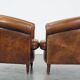 Set of 2 club armchairs in sheepskin leather with black piping