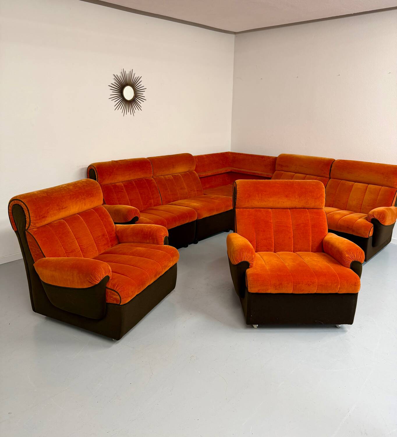 Modular vintage orange corner sofa, 1970s pop design.