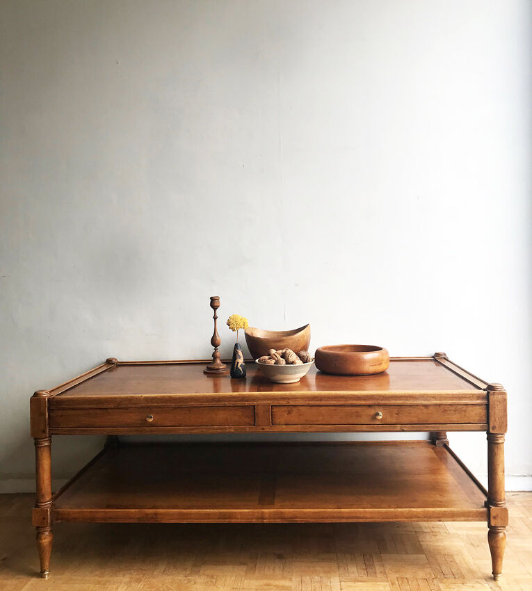 A solid wood-marked coffee table.