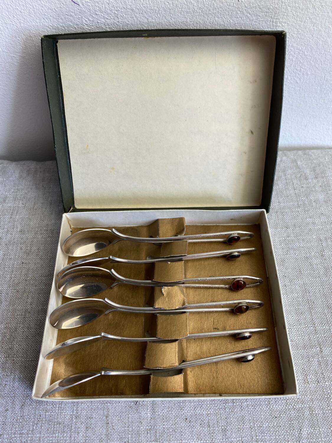 Art Nouveau metal and amber spoons