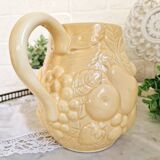 Vintage yellow pitcher in fruit slip