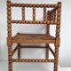 A wooden corner chair turned 1920s