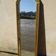 Hallway mirror, gilded frame, curtains and fleur-de-lis